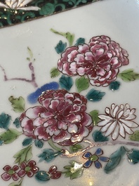 A pair of Chinese famille rose black-ground 'flowers and scrolls' plates, Yongzheng/Qianlong