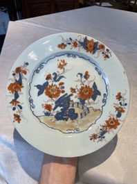 A group of thirteen Chinese blue, white and famille rose plates and a bowl, late Ming/early Qing