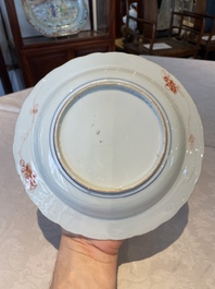 A group of thirteen Chinese blue, white and famille rose plates and a bowl, late Ming/early Qing