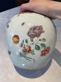 A pair of fine Chinese famille rose 'botanical Merian-style' jars with wooden covers, Qianlong