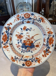 A group of thirteen Chinese blue, white and famille rose plates and a bowl, late Ming/early Qing