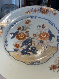 A group of thirteen Chinese blue, white and famille rose plates and a bowl, late Ming/early Qing