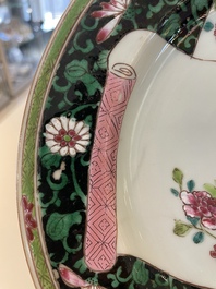 A pair of Chinese famille rose black-ground 'flowers and scrolls' plates, Yongzheng/Qianlong