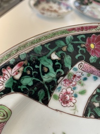 A pair of Chinese famille rose black-ground 'flowers and scrolls' plates, Yongzheng/Qianlong