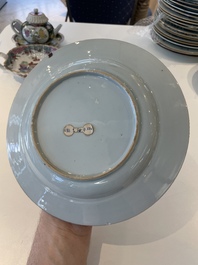 A pair of Chinese famille rose black-ground 'flowers and scrolls' plates, Yongzheng/Qianlong