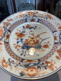 A group of thirteen Chinese blue, white and famille rose plates and a bowl, late Ming/early Qing