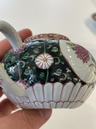 A Chinese famille rose black-ground teapot with cover and stand and a sauce boat, Qianlong