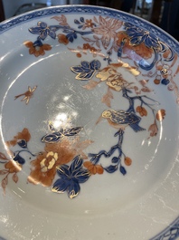 A group of thirteen Chinese blue, white and famille rose plates and a bowl, late Ming/early Qing