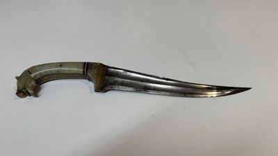 A collection of three daggers decorated with jade, silver and gold and an Indian mogul sword, India, 17/19th C.