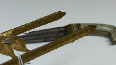 A collection of three daggers decorated with jade, silver and gold and an Indian mogul sword, India, 17/19th C.
