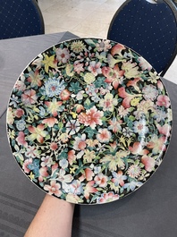 A Chinese famille rose 'mille fleur' dish, a famille verte plate and a pair of famille rose plates, Qianlong mark, 19/20th C.