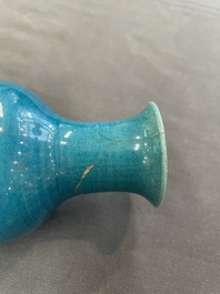Three Chinese monochrome turquoise-glazed vases with two wooden stands, Kangxi and later