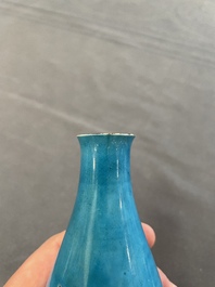 Three Chinese monochrome turquoise-glazed vases with two wooden stands, Kangxi and later