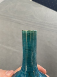 Three Chinese monochrome turquoise-glazed vases with two wooden stands, Kangxi and later