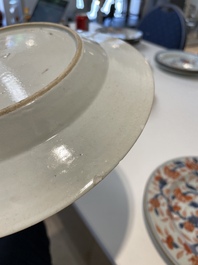 A varied collection of thirteen Chinese blue and white, Imari-style, famille rose and famille verte plates, Kangxi/Qianlong