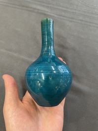 Three Chinese monochrome turquoise-glazed vases with two wooden stands, Kangxi and later