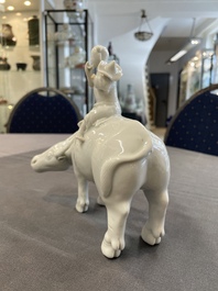 A Chinese blue and white garlic-mouth vase and a white glazed group of a boy on a buffalo, Wanli/Qianlong