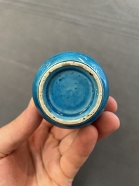 Three Chinese monochrome turquoise-glazed vases with two wooden stands, Kangxi and later