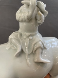 A Chinese blue and white garlic-mouth vase and a white glazed group of a boy on a buffalo, Wanli/Qianlong