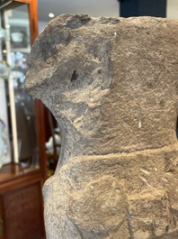 A sandstone torso and a Buddha head, Cambodia, late Khmer period, 13/14th C.