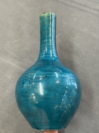 Three Chinese monochrome turquoise-glazed vases with two wooden stands, Kangxi and later
