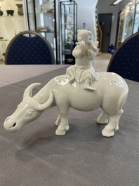 A Chinese blue and white garlic-mouth vase and a white glazed group of a boy on a buffalo, Wanli/Qianlong