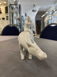 A Chinese blue and white garlic-mouth vase and a white glazed group of a boy on a buffalo, Wanli/Qianlong