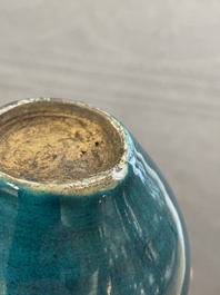 Three Chinese monochrome turquoise-glazed vases with two wooden stands, Kangxi and later
