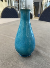Three Chinese monochrome turquoise-glazed vases with two wooden stands, Kangxi and later