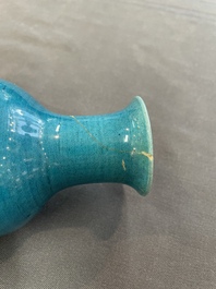Three Chinese monochrome turquoise-glazed vases with two wooden stands, Kangxi and later