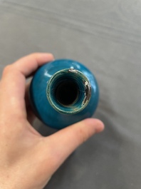 Three Chinese monochrome turquoise-glazed vases with two wooden stands, Kangxi and later
