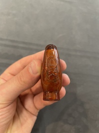 Eleven Chinese snuff bottles in amber, agate, rock crystal, lacquer, hardstone, metal and wood, 19/20th C.