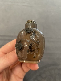 Eleven Chinese snuff bottles in amber, agate, rock crystal, lacquer, hardstone, metal and wood, 19/20th C.