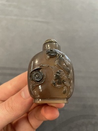 Eleven Chinese snuff bottles in amber, agate, rock crystal, lacquer, hardstone, metal and wood, 19/20th C.
