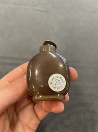Eleven Chinese snuff bottles in amber, agate, rock crystal, lacquer, hardstone, metal and wood, 19/20th C.