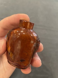 Eleven Chinese snuff bottles in amber, agate, rock crystal, lacquer, hardstone, metal and wood, 19/20th C.