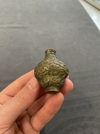 Eleven Chinese snuff bottles in amber, agate, rock crystal, lacquer, hardstone, metal and wood, 19/20th C.