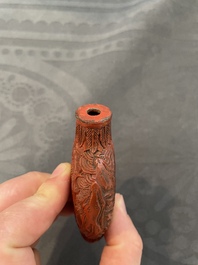 Eleven Chinese snuff bottles in amber, agate, rock crystal, lacquer, hardstone, metal and wood, 19/20th C.