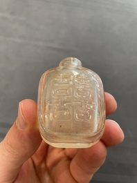 Eleven Chinese snuff bottles in amber, agate, rock crystal, lacquer, hardstone, metal and wood, 19/20th C.