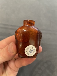 Eleven Chinese snuff bottles in amber, agate, rock crystal, lacquer, hardstone, metal and wood, 19/20th C.