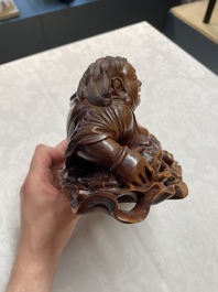 Two Chinese boxwood sculptures of Luohan and Liuhai and a bamboo sculpture of a sage, 17/19th C.