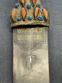 A varied collection of four decorated daggers, two inset with red coral and turquoise, Sri Lanka and Georgia, 18/19th C.