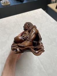 Two Chinese boxwood sculptures of Luohan and Liuhai and a bamboo sculpture of a sage, 17/19th C.