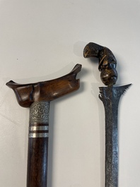 A collection of six krises with carved handles, four with scabbard, Indonesia, 19th C.
