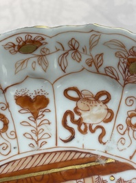A pair of Chinese iron-red saucers and two plates, Kangxi/Yongzheng