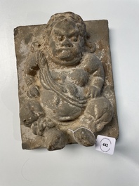 A Chinese architectural pottery tile of a 'non-Han' figure, Song/Jin