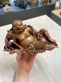 Two Chinese boxwood sculptures of Luohan and Liuhai and a bamboo sculpture of a sage, 17/19th C.
