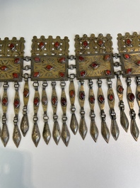 Three silver head ornaments and a chest ornament, Turkmenistan, 19/20th C.