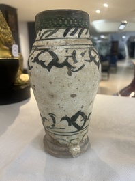 An early Islamic pottery albarello with engraved copper mount and cover, probably Nishapur, Iran, 10/11th C.