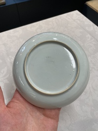 A pair of Chinese iron-red saucers and two plates, Kangxi/Yongzheng
